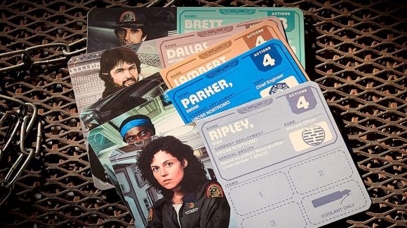 Alien: Fate of the Nostromo board game review - Sales photo showing the player cards from the game, with Ripley in front