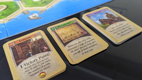 How to play Catan - photo of development cards from Settlers of Catan
