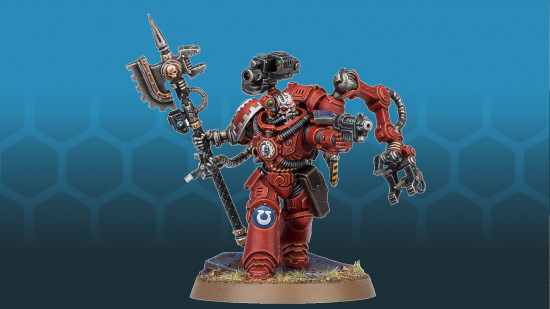 Warhammer 40k Space Marines tech marine - a red armored warrior wielding a massive axe, with a large robo claw