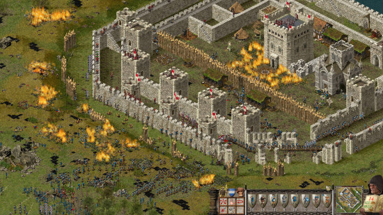 Screenshot of a castle under siege in Stronghold Definitive Edition, one of the best RTS games of all time