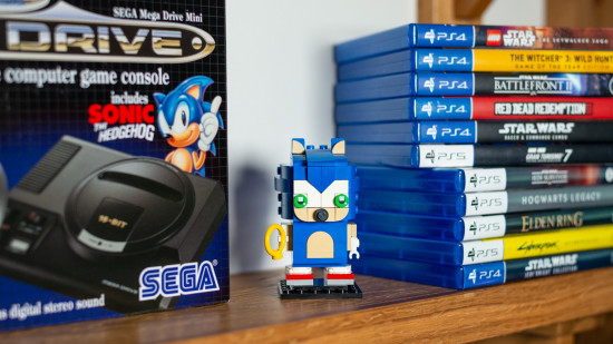 Lego Sonic the Hedgehog BrickHeadz review imae showing the constructed model on a shelf besides a collection of games.