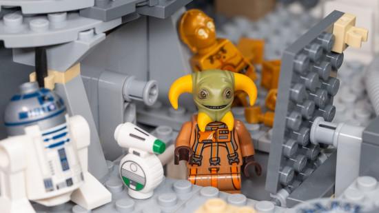 Lego Star Wars: Millennium Falcon review image showing Boolio hanging out in the ship with the droids.