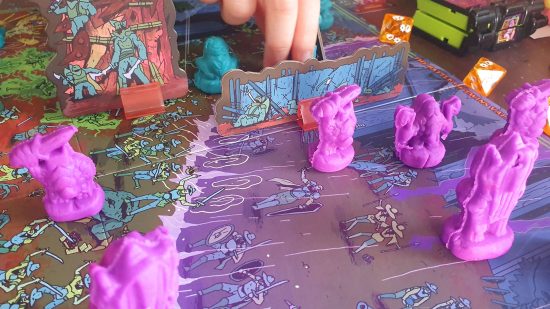 Necromolds review - a battle in progress, purple Mud Mumps and Grave Ghouls march slowly up the field