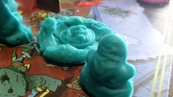 Necromolds review - a flattened monster made out of teal clay with an embossed Caster Ring symbol marked in it