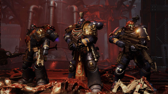 Three Ultramarines Space Marines stand on a pile of gore in Space Marine 2 PVE mutliplayer mode
