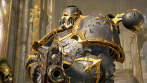 Space Marine 2 PVP multiplayer - a grim-helmed Iron Warriors Chaos Space Marine in gold-trimmed silve armor
