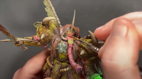 Max from Lizard of Doom painting a Nurgle corrupted Gundam model kit