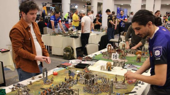 A competitive game of Warhammer Age of Sigmar takes place at a large tournament - photograph from Warhammer Community