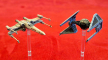 Star Wars X-Wing and Armada end development - Wargamer photo showing an X-Wing and TIE Interceptor minis from X-Wing