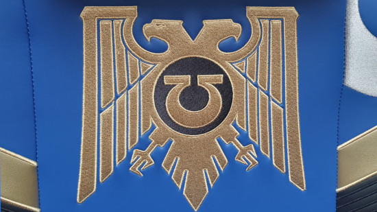 The gold Aquila of the Imperium, as embroidered on the Warhammer 40k gaming chair