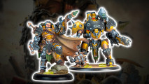 Warmachine Magnus the Unstoppable and Invictus, an armored man with a cape and a rocket launcher, and a huge war robot with a chainsaw and a missile pod on one shoulder